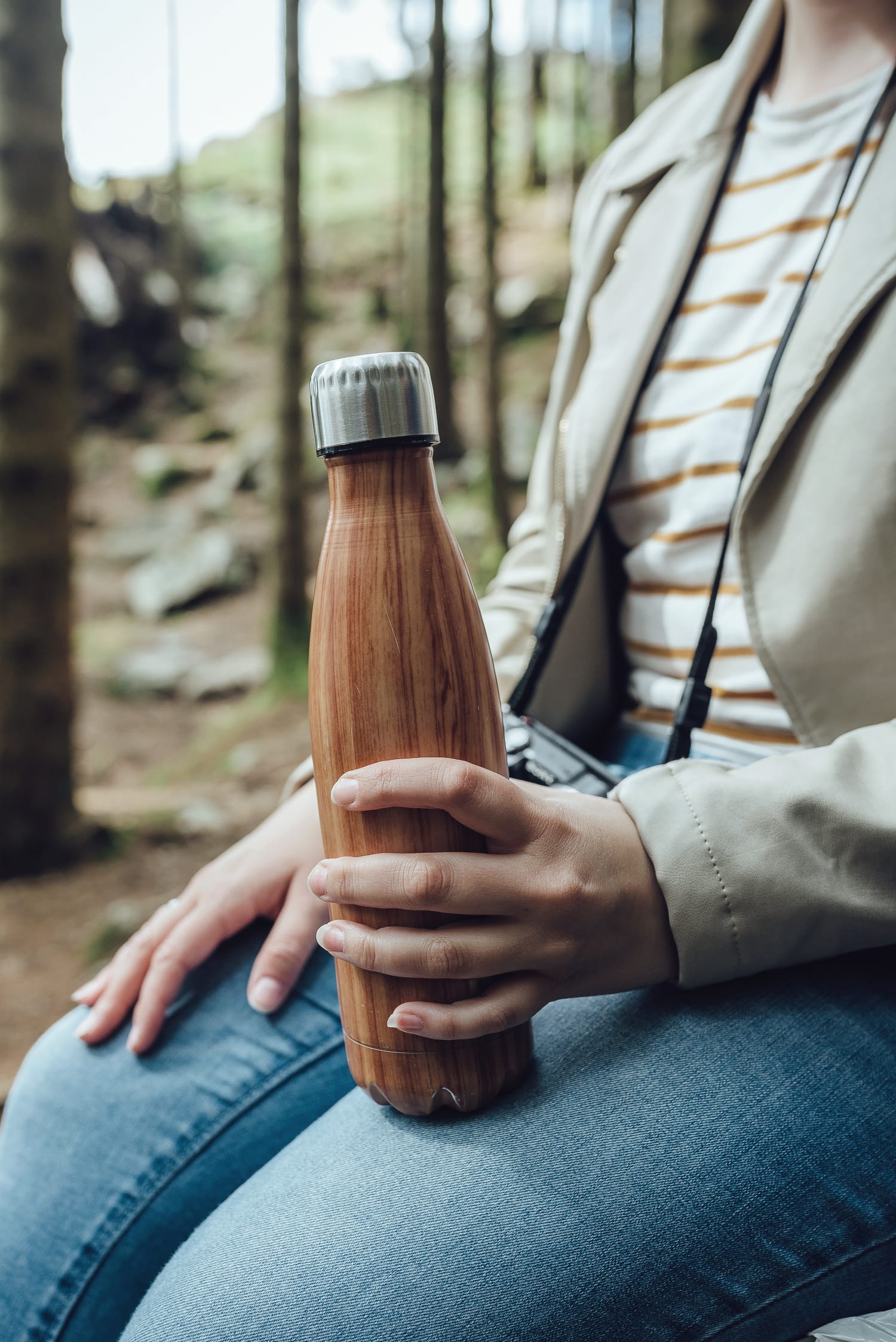 hand holding water bottle