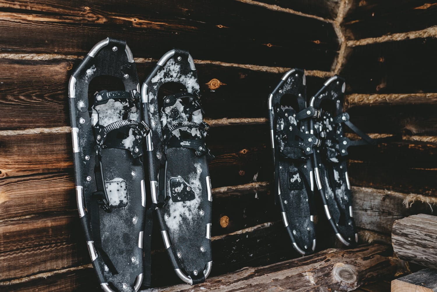 snowshoes by a cabin