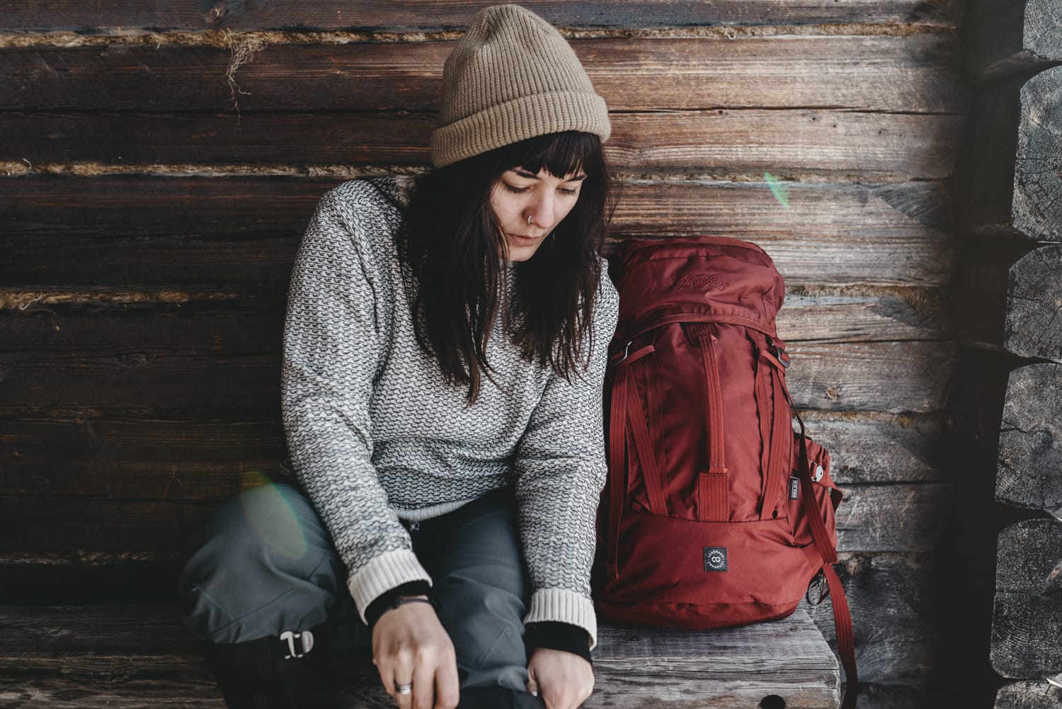 Woman with Lundhags backpack getting ready for a winter hike