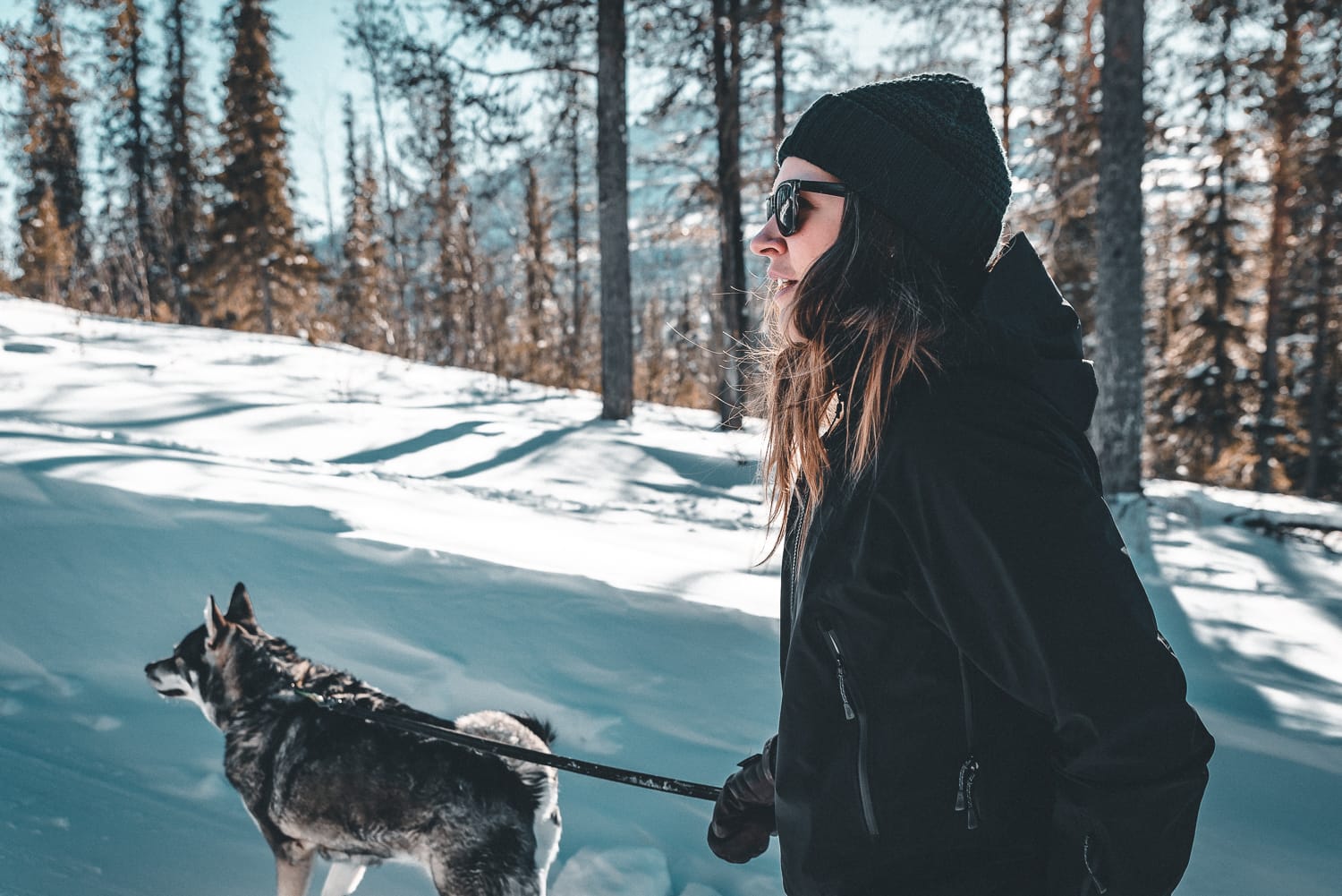 Woman on a winter walk with her dog