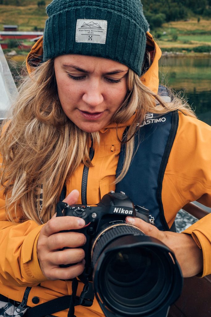 woman on a boat with a camera