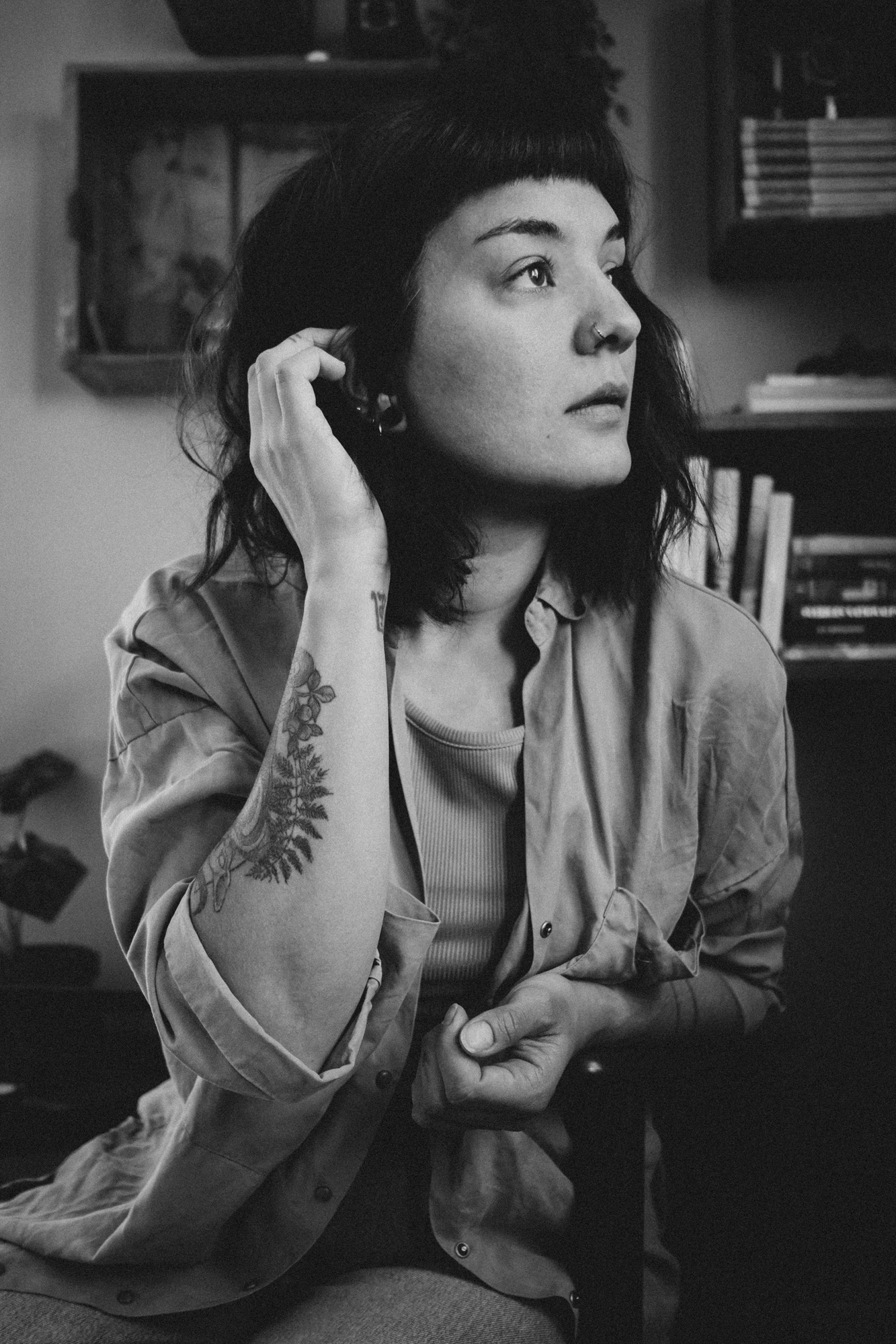 Black and white portrait of a woman with short dark hair and bangs