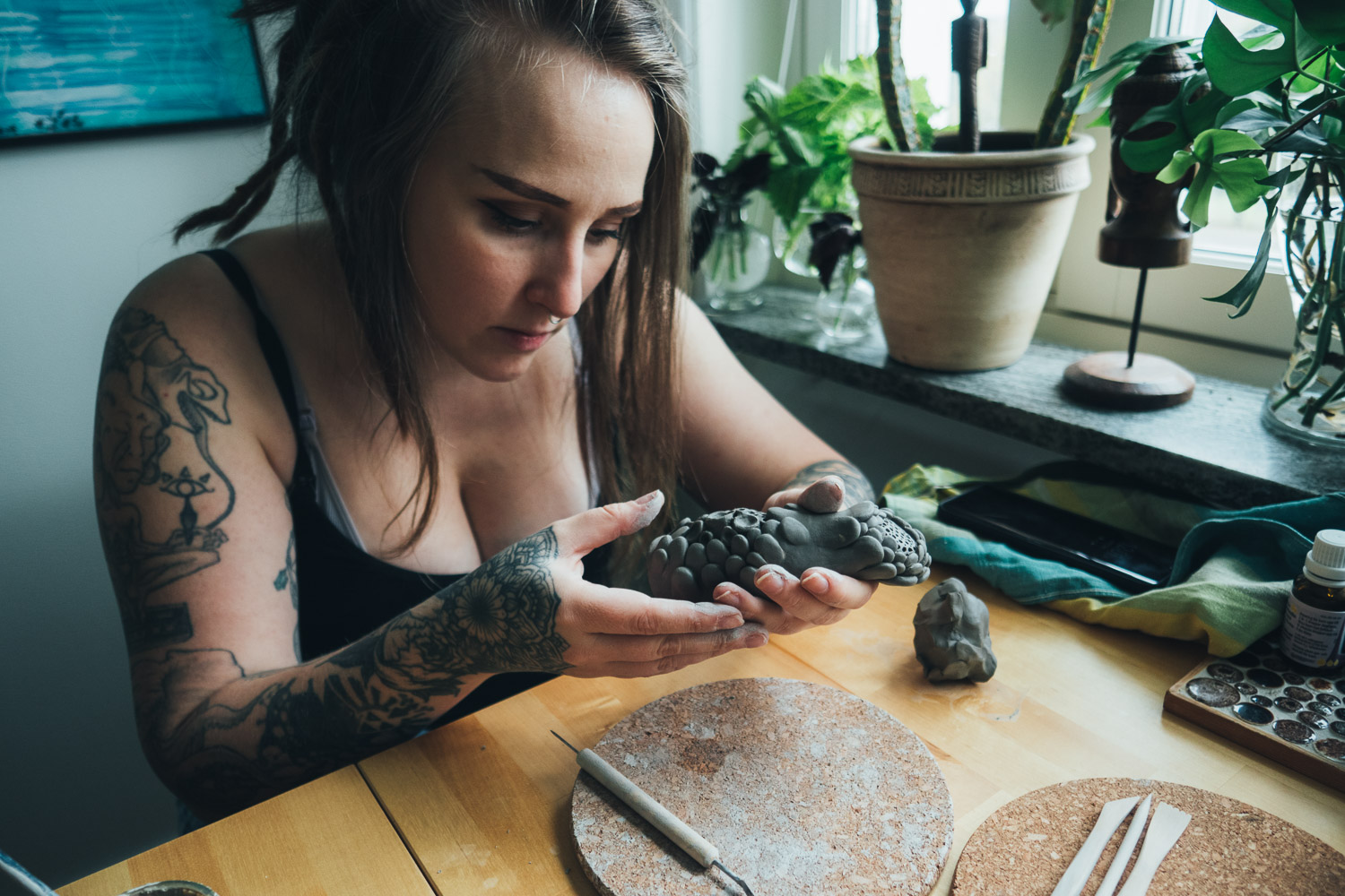 woman sculpting in clay