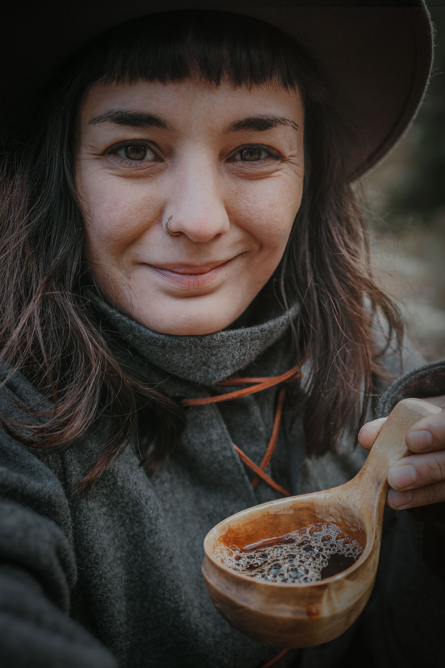 woman having coffee in a forest
