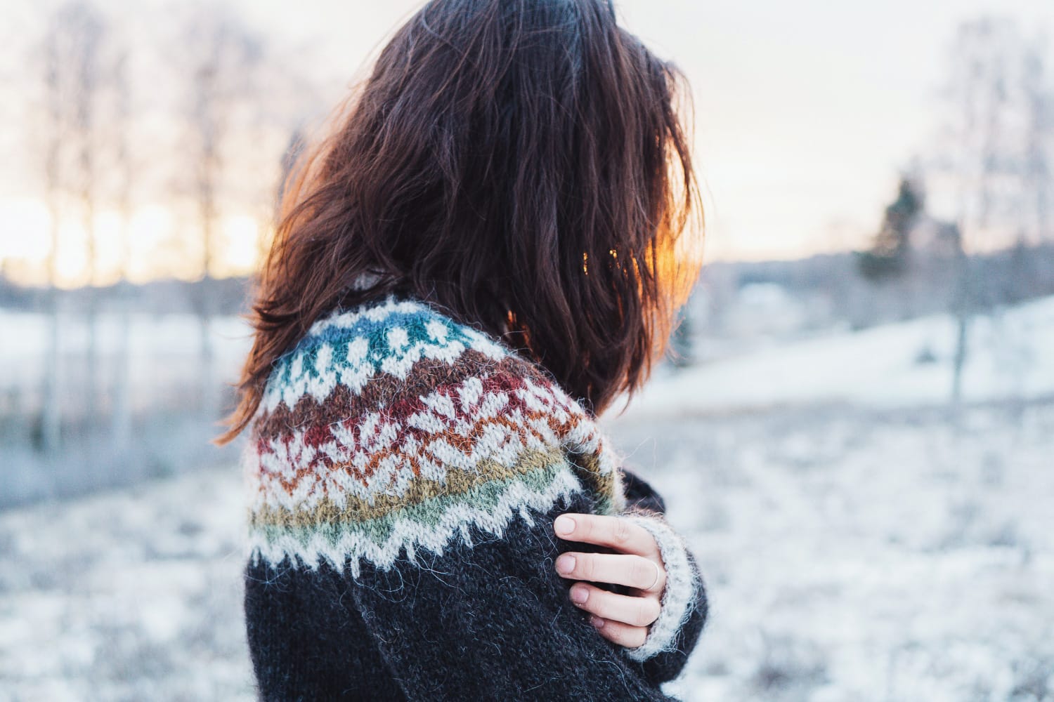 woman in a knitted sweater out in winter