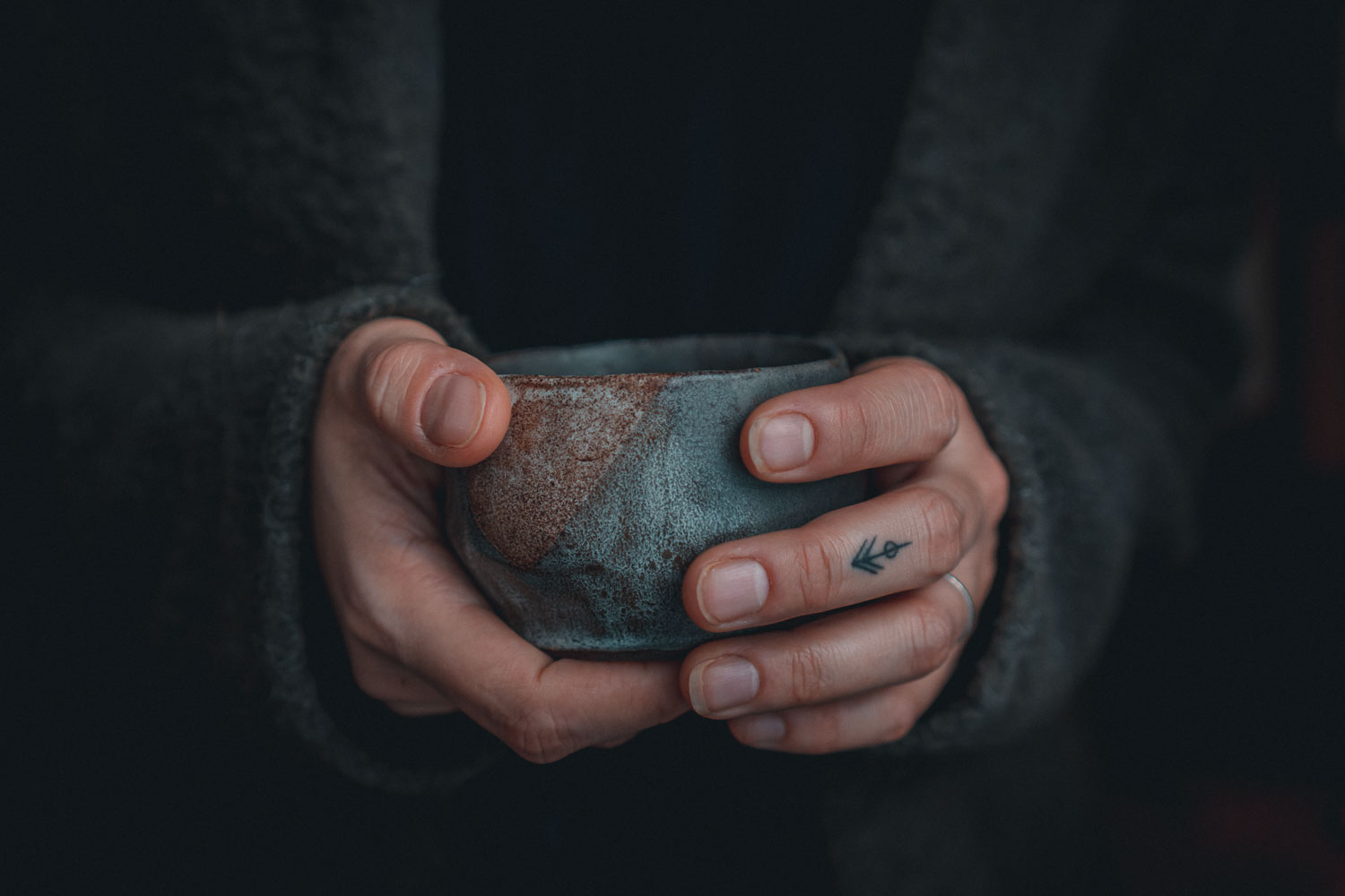 hands holding handmade ceramic mug