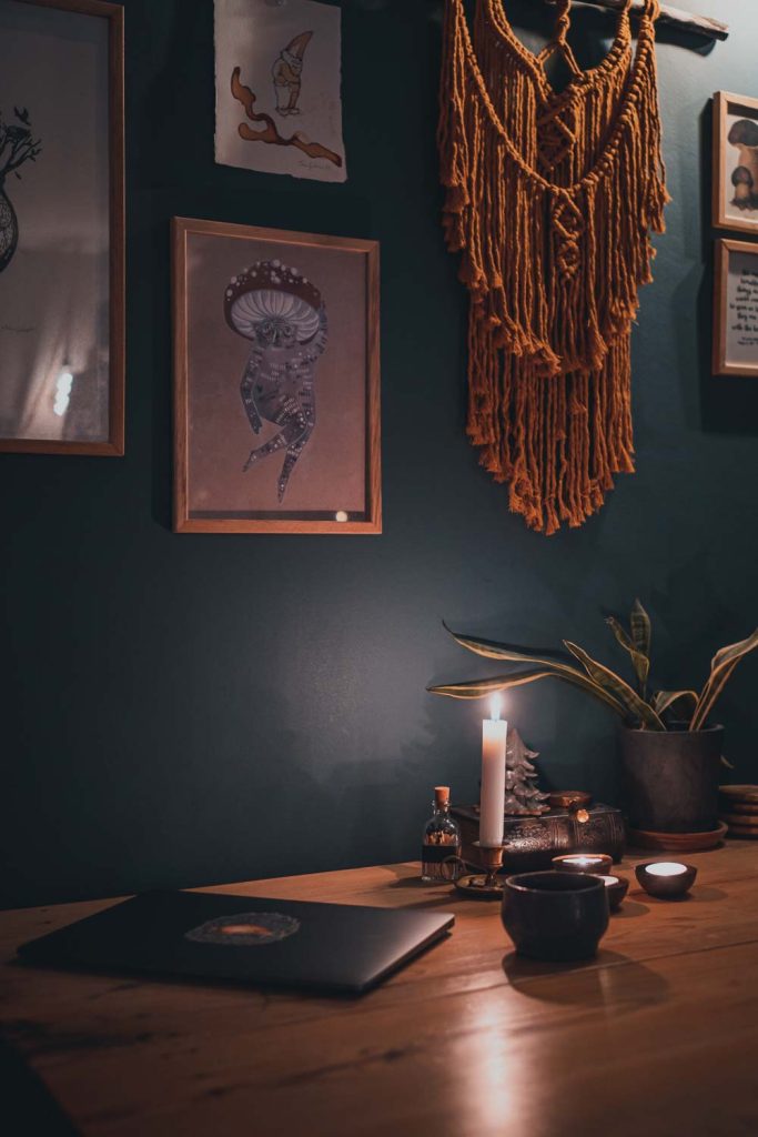 laptop, coffee and candles on a table