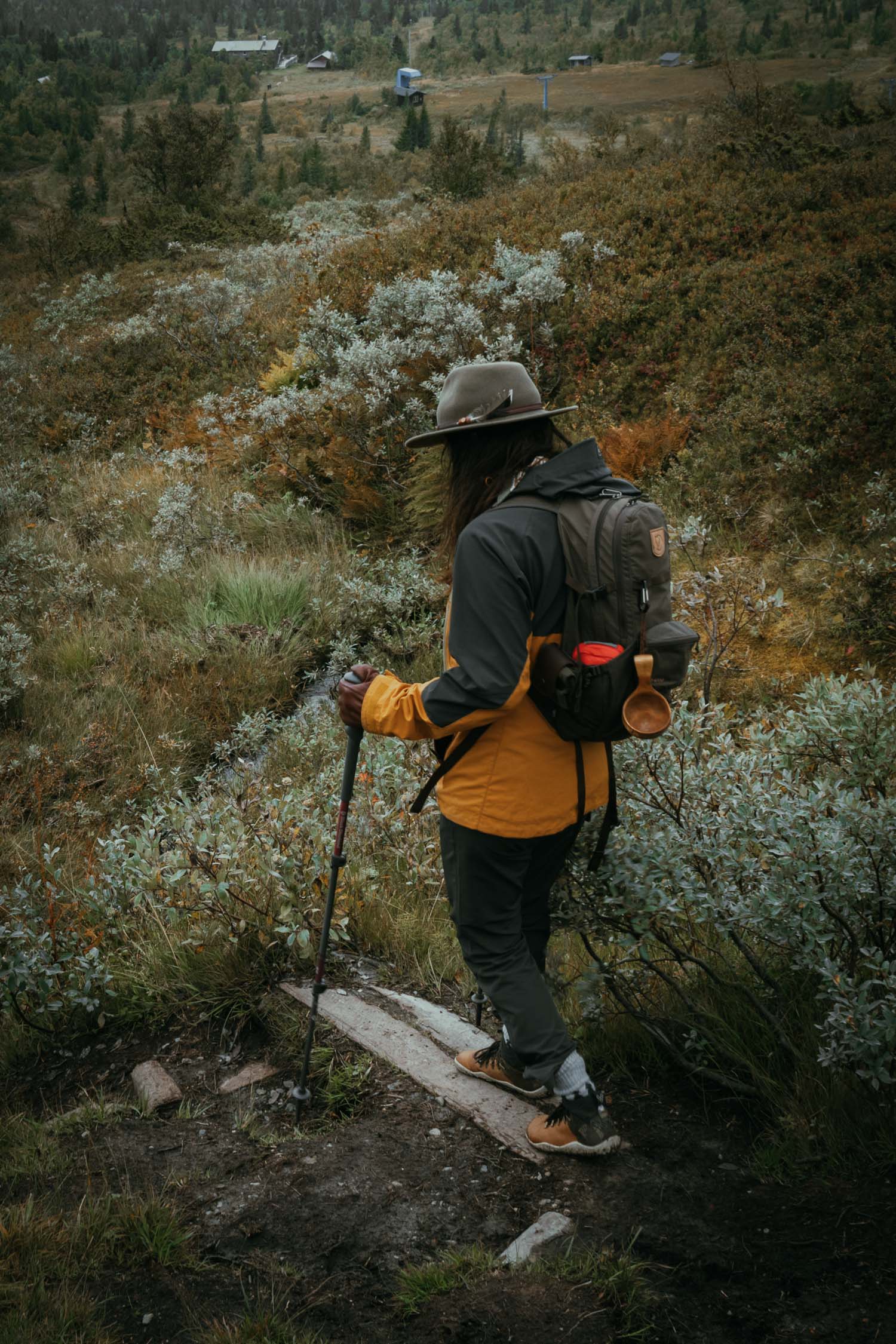 woman hiking with poles