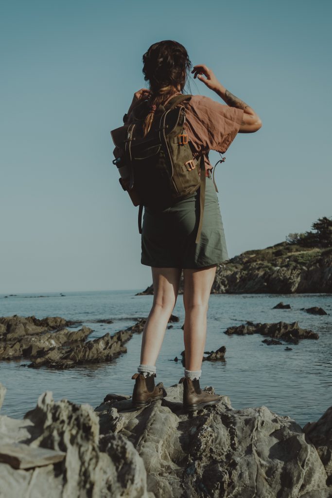 woman standing by the sea