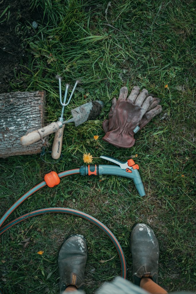 garden hose, tools and gloves