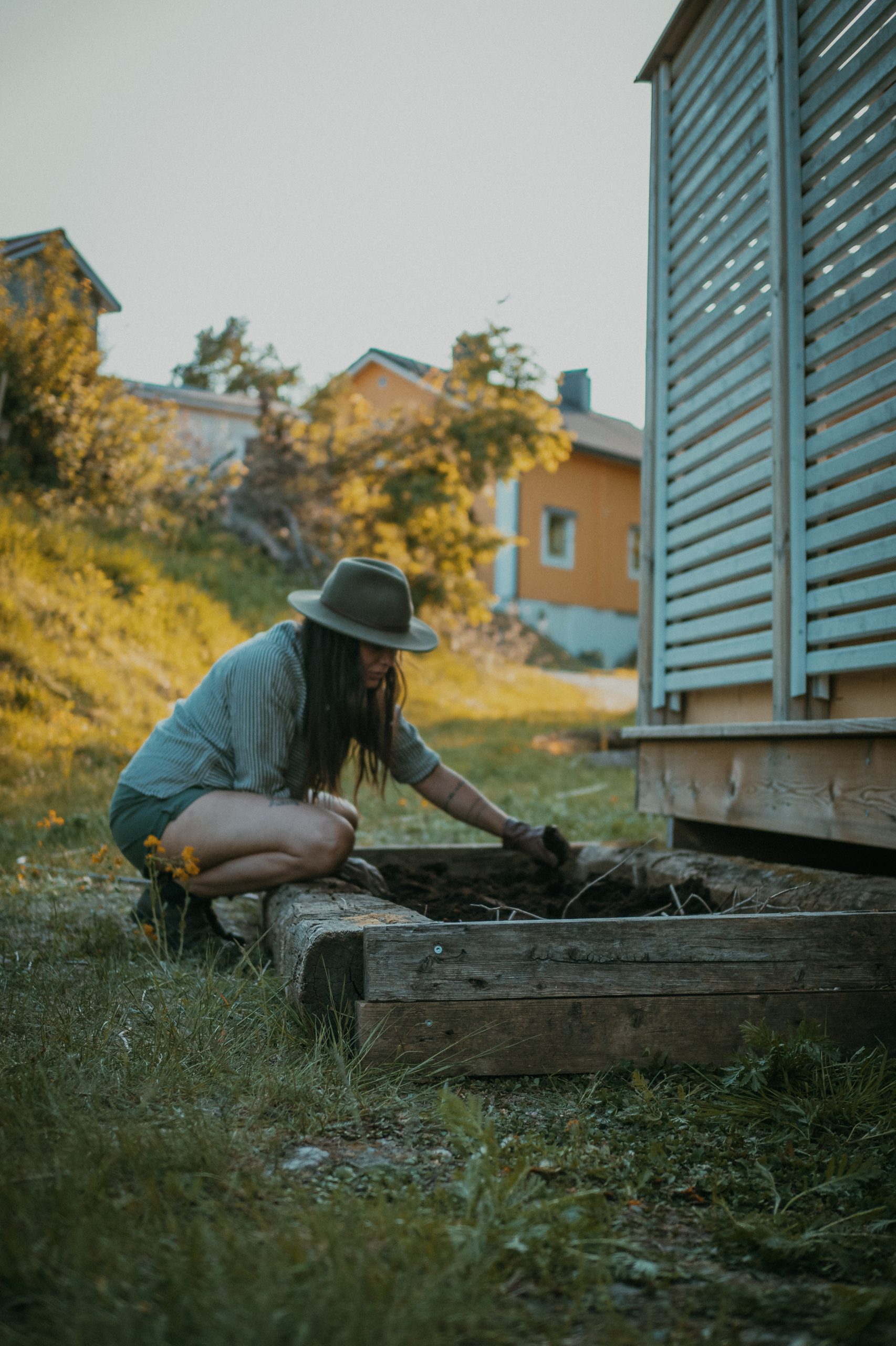 woman working by a garden box