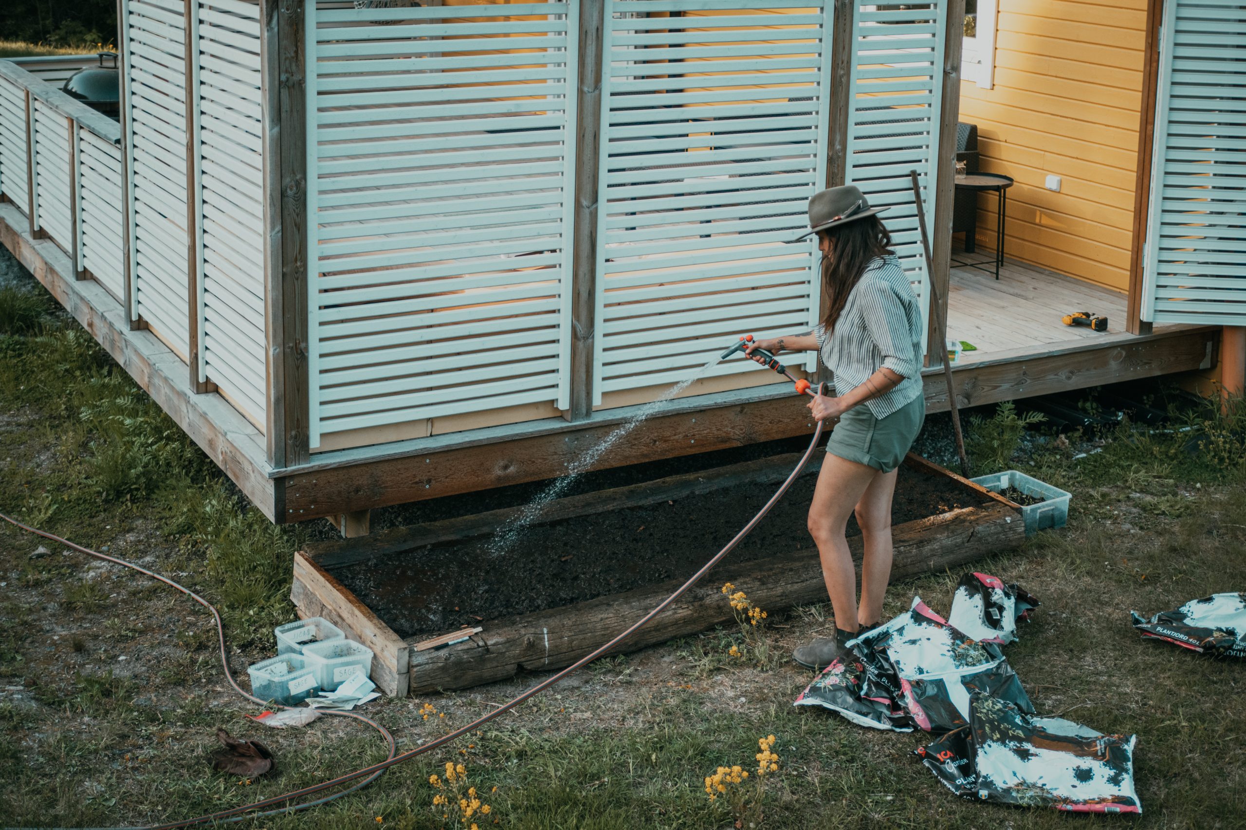 woman watering her garden