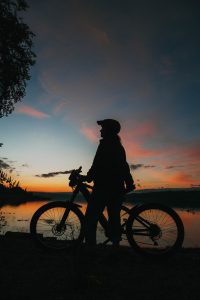 silhouette of female with her mountainbike