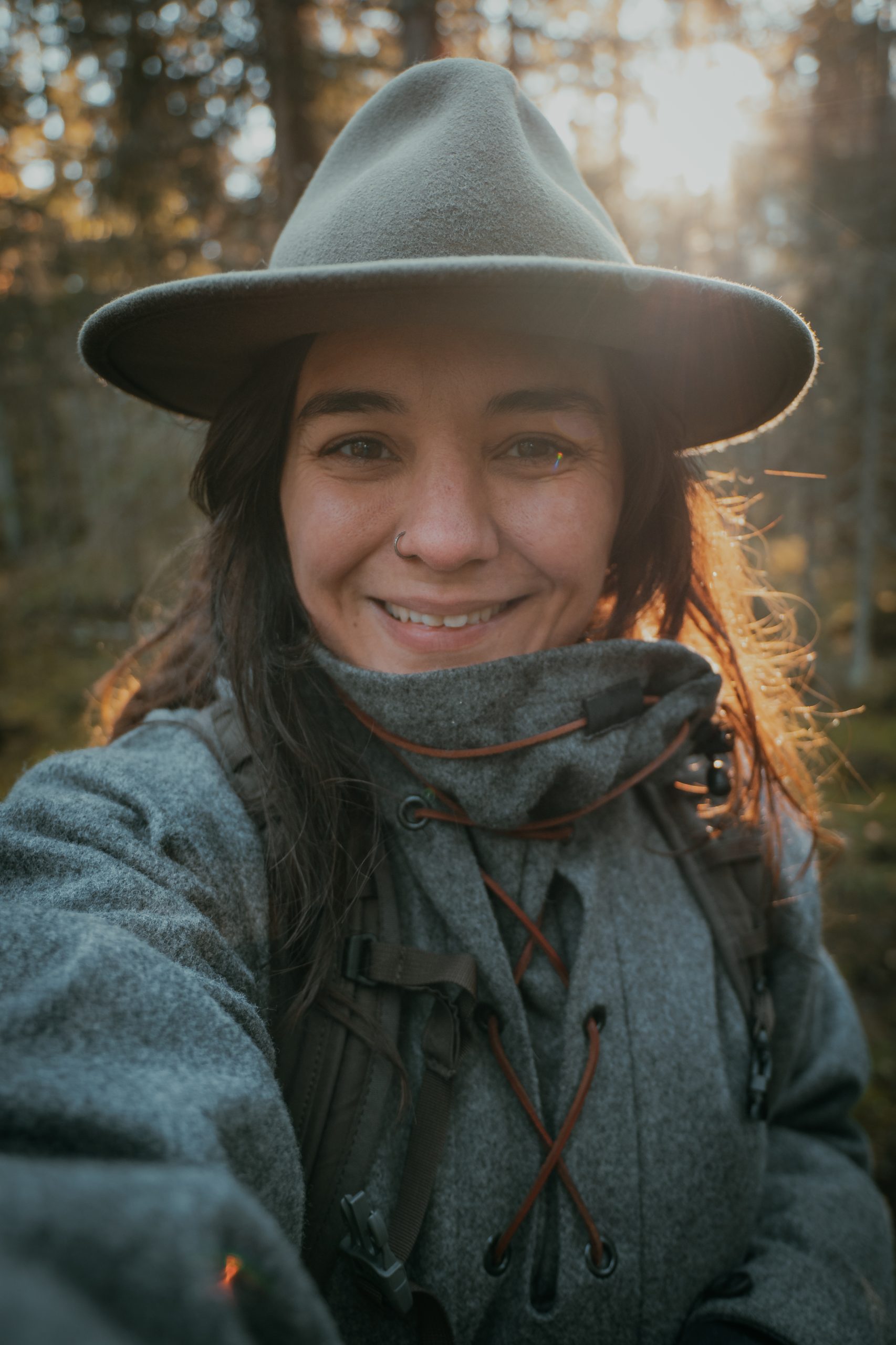 sunny portrait of a woman in the forest